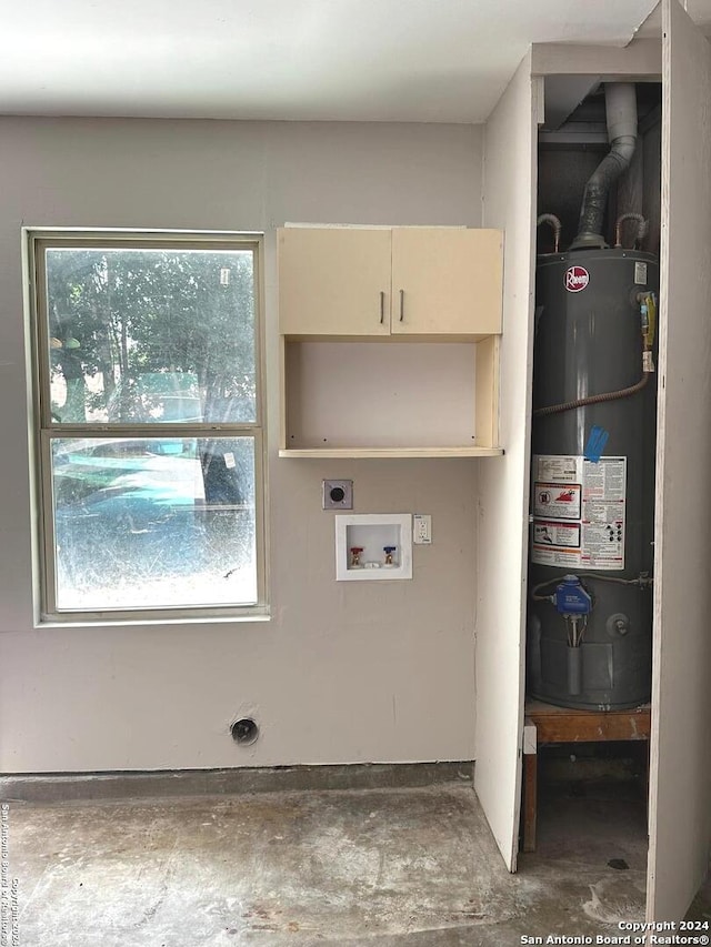 laundry room with hookup for a washing machine, gas water heater, and electric dryer hookup