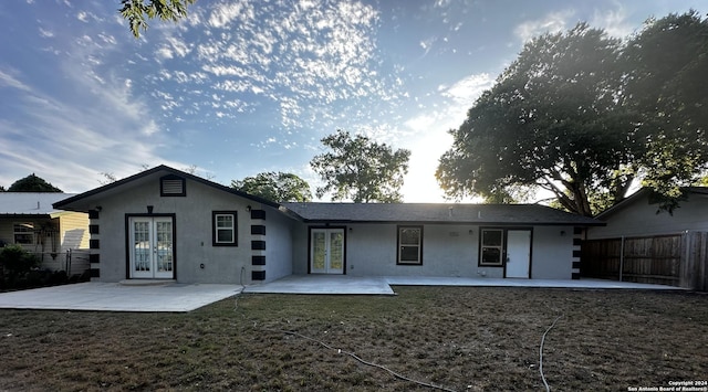 rear view of property featuring french doors and a patio