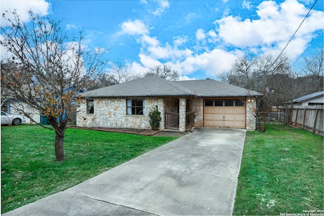 view of front facade with a front yard and a garage