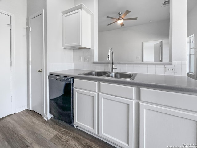 kitchen featuring white cabinets, black dishwasher, dark hardwood / wood-style flooring, decorative backsplash, and sink