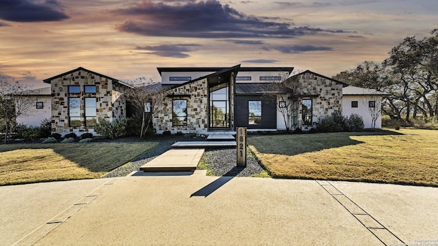 view of front of property with a lawn