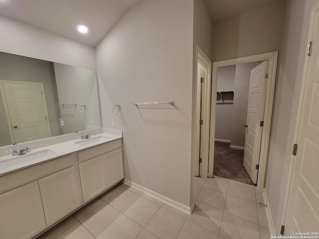 bathroom with tile patterned floors and vanity