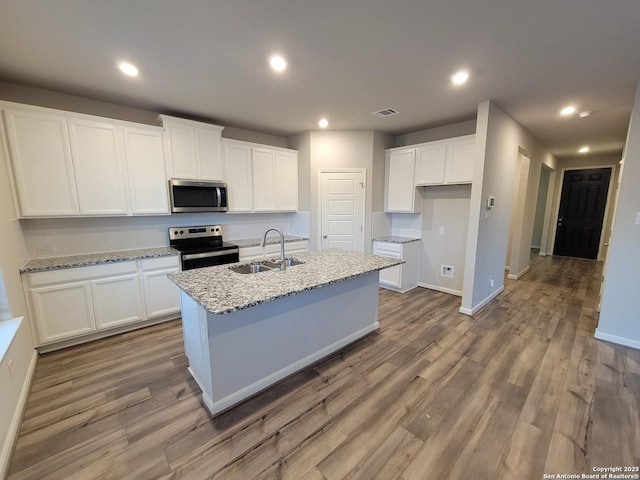 kitchen with sink, white cabinetry, and stainless steel appliances