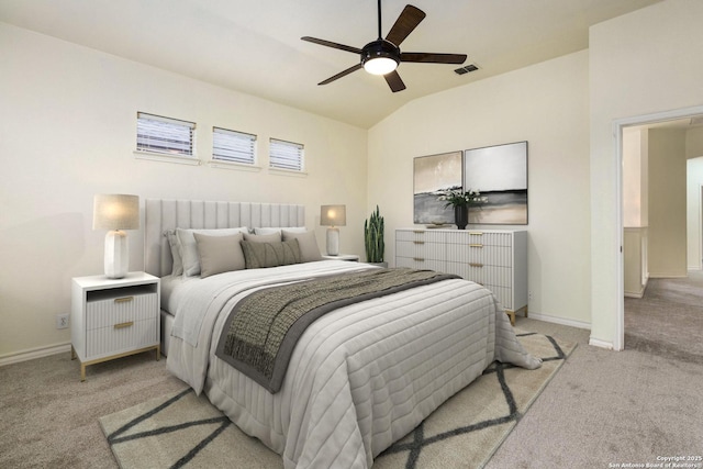 carpeted bedroom featuring lofted ceiling and ceiling fan