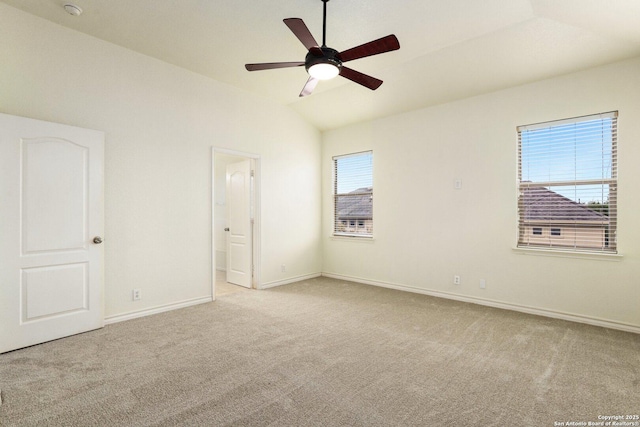 unfurnished room with ceiling fan, light colored carpet, and lofted ceiling