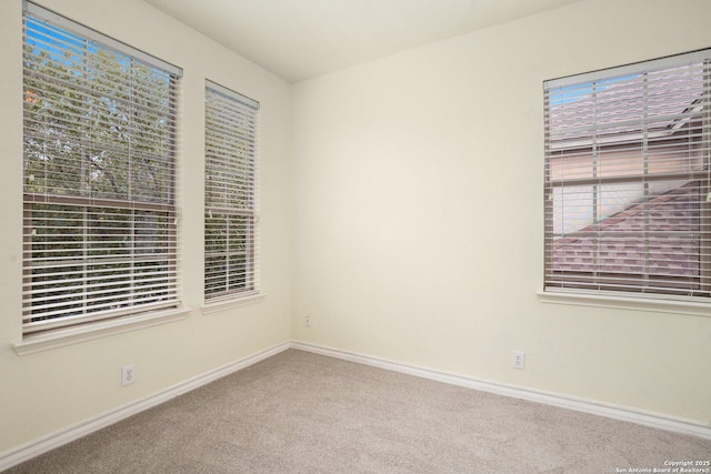 empty room with carpet flooring