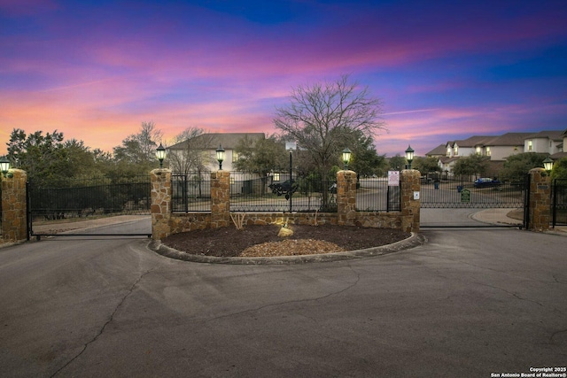 view of gate at dusk