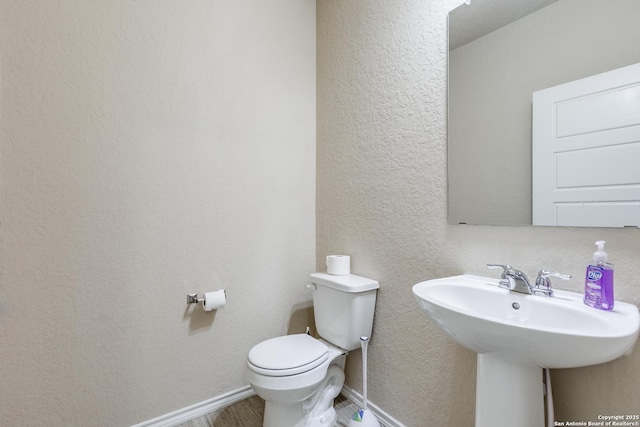 bathroom with sink and toilet