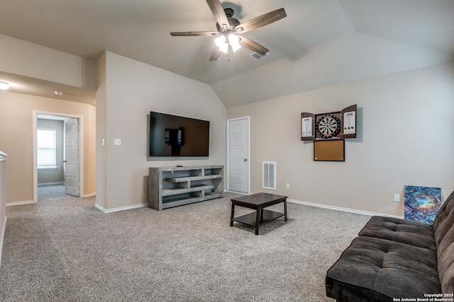 carpeted living room featuring vaulted ceiling and ceiling fan