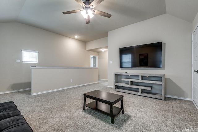 carpeted living room featuring ceiling fan and lofted ceiling