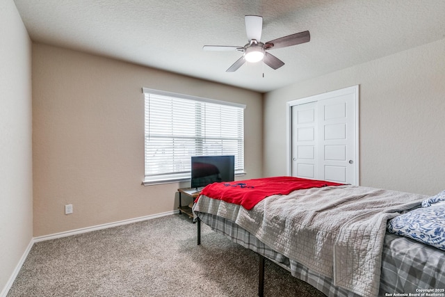 bedroom with ceiling fan and carpet floors