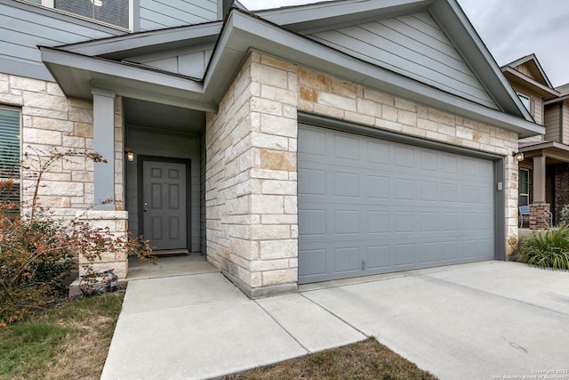 view of exterior entry featuring a garage