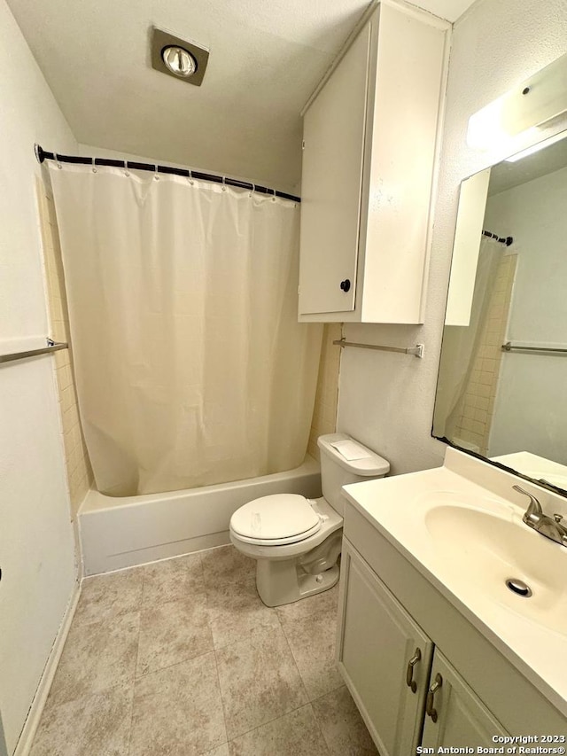 full bathroom with toilet, vanity, and shower / bath combo with shower curtain