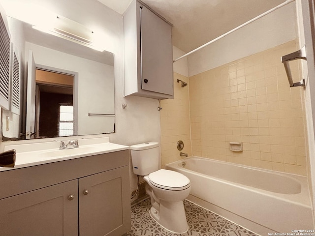 full bathroom featuring toilet, tile patterned flooring, tiled shower / bath, and vanity