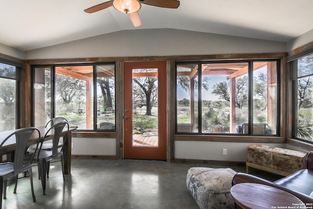 sunroom with ceiling fan and vaulted ceiling