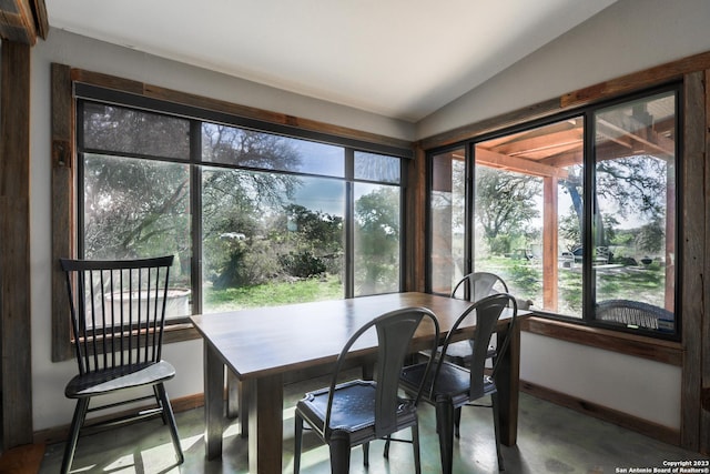 sunroom / solarium featuring vaulted ceiling