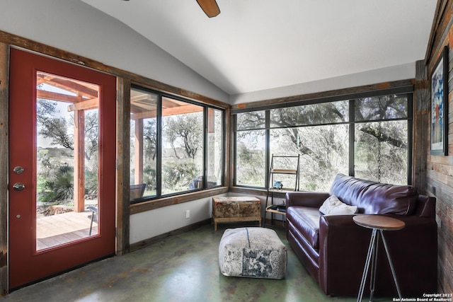 sunroom / solarium featuring ceiling fan and vaulted ceiling