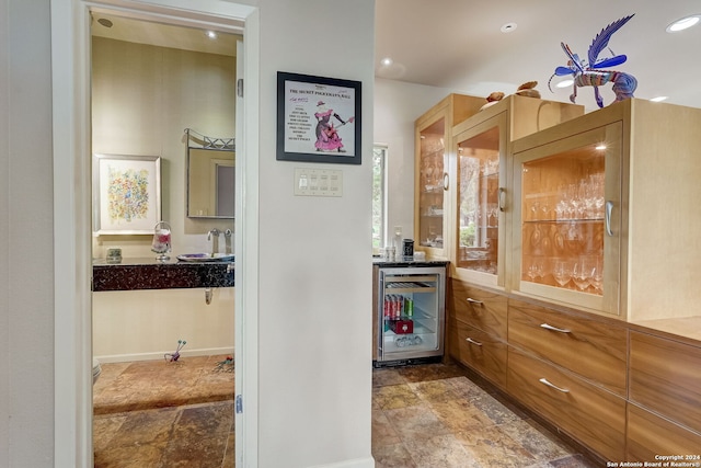 interior space with sink and beverage cooler