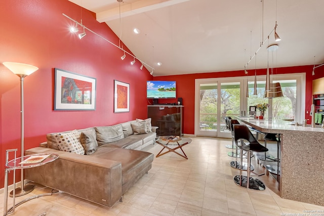 living room featuring high vaulted ceiling and beamed ceiling