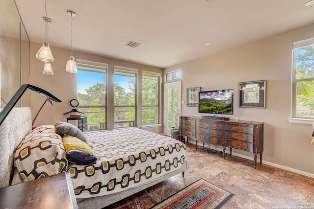 bedroom featuring multiple windows