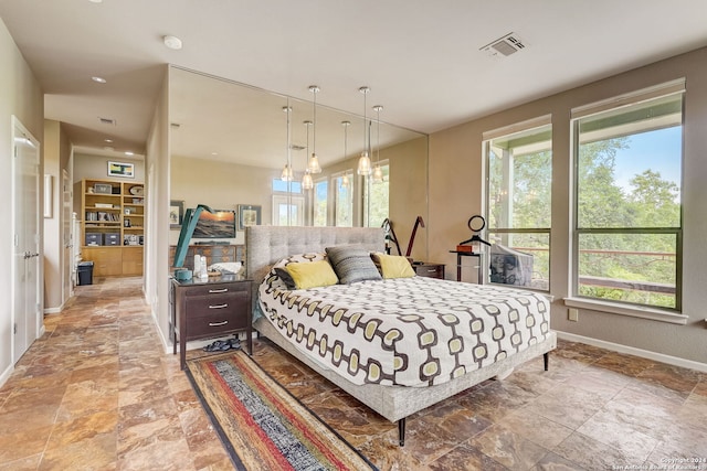 bedroom with an inviting chandelier