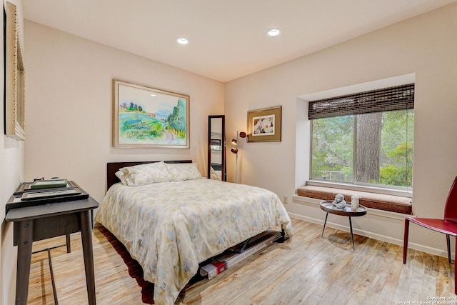 bedroom with hardwood / wood-style floors