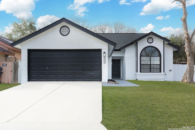 ranch-style home featuring a front lawn and a garage