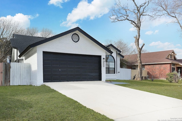 ranch-style home featuring a front lawn and a garage