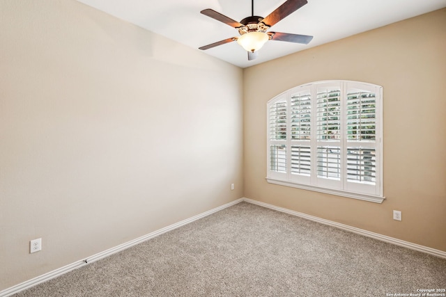 spare room with carpet floors and ceiling fan