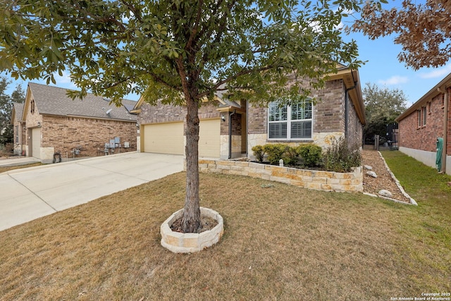 view of front facade with a garage and a front yard