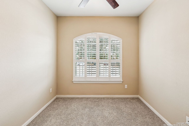 carpeted empty room with ceiling fan