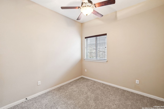 carpeted empty room with ceiling fan