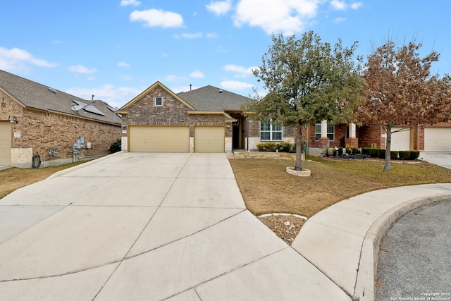 view of front of property featuring a garage and a front lawn