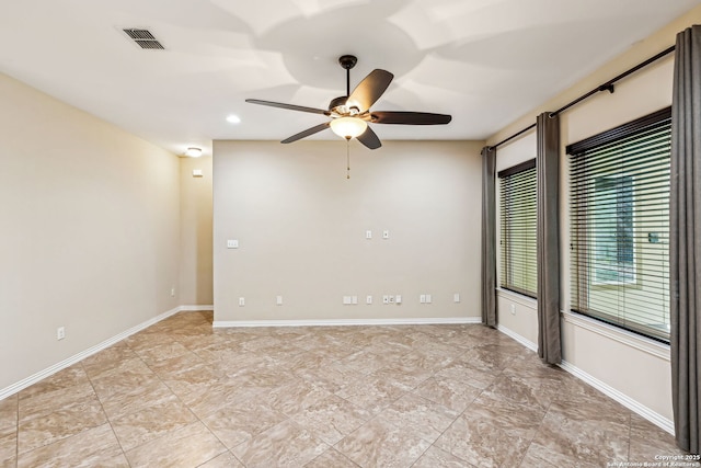 spare room with ceiling fan