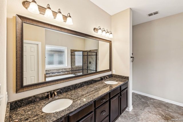 bathroom with vanity and shower with separate bathtub