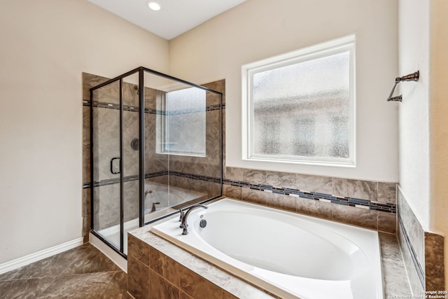 bathroom with shower with separate bathtub