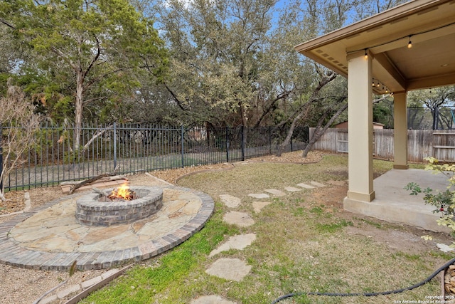 view of yard with a patio area and a fire pit