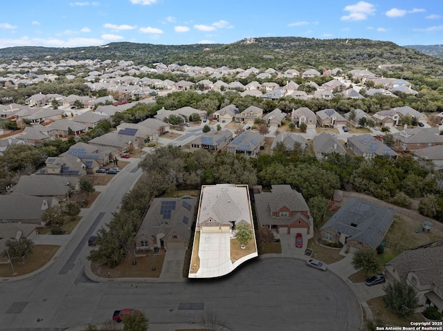 birds eye view of property featuring a mountain view