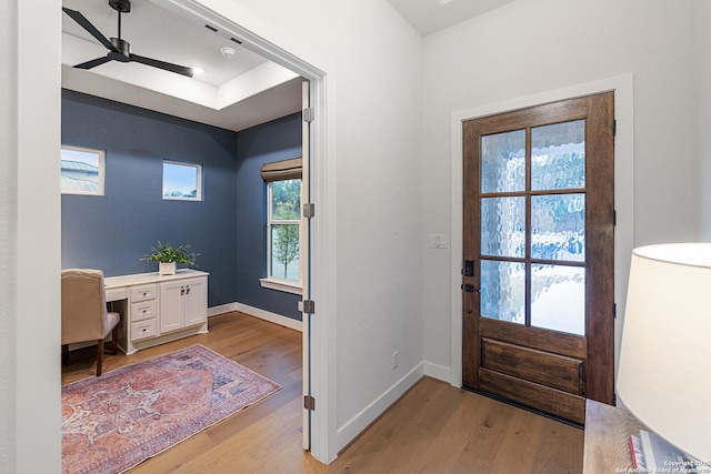 entryway with ceiling fan and light hardwood / wood-style floors