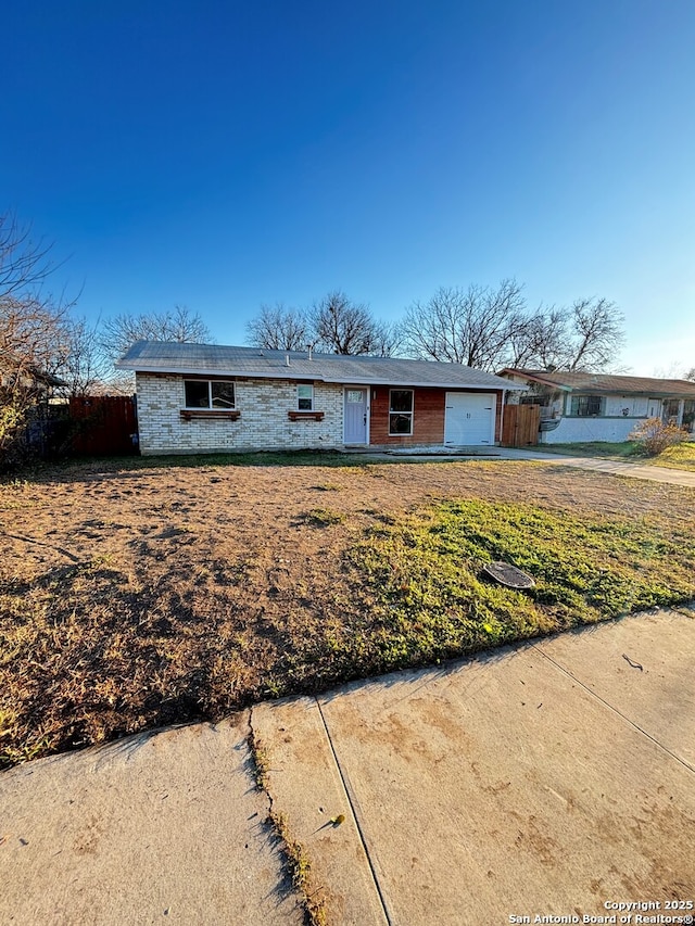 single story home with a garage