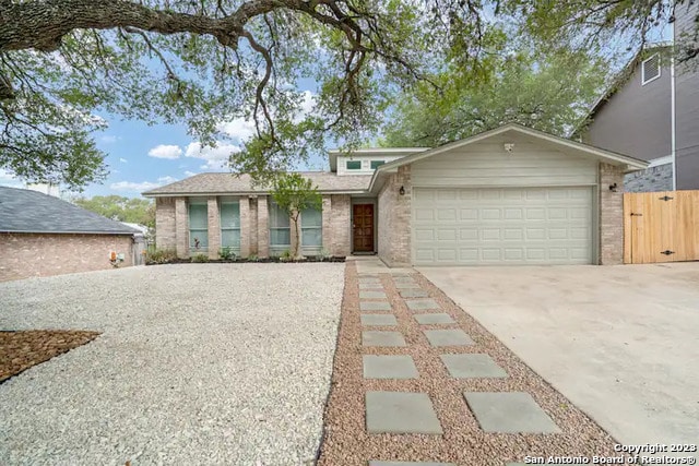 ranch-style home featuring a garage