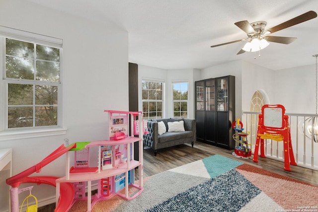 game room featuring ceiling fan and wood finished floors