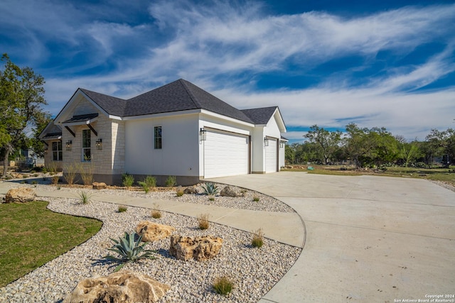 view of side of home with a garage