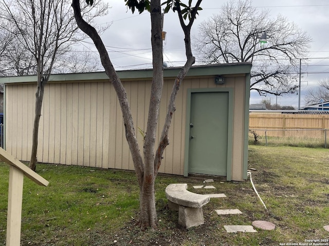 view of outdoor structure with a lawn