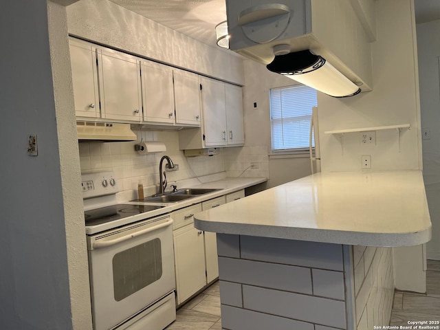 kitchen with sink, white cabinets, tasteful backsplash, and white range with electric cooktop