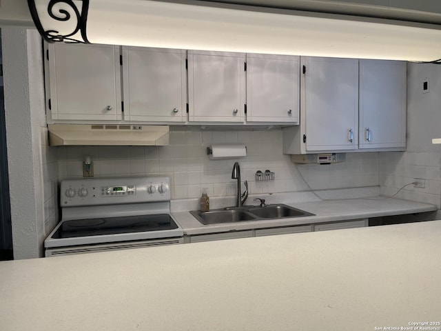 kitchen with sink, white range with electric stovetop, and tasteful backsplash