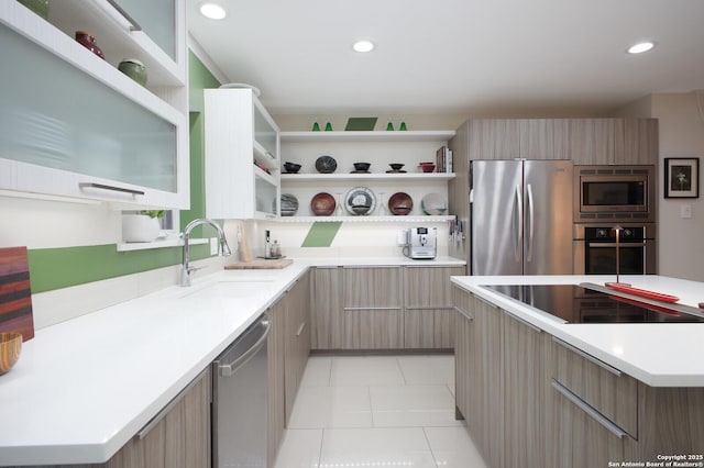 kitchen with sink, light tile patterned floors, stainless steel appliances, and a kitchen island