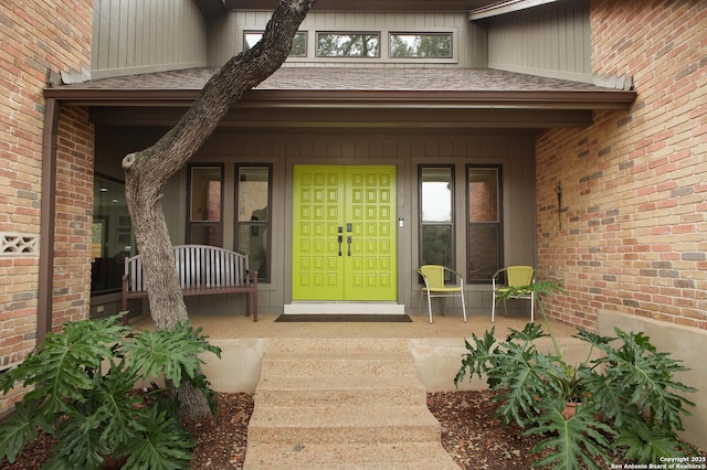 view of exterior entry featuring french doors