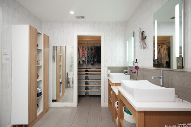 bathroom with tile patterned floors and vanity