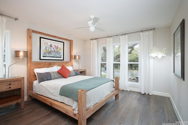 bedroom featuring dark wood-type flooring and ceiling fan